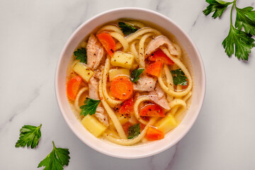 Chicken soup with noodles and vegetables