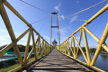 Fototapeta na wymiar Bamboo bridge in the mangrove forest area.