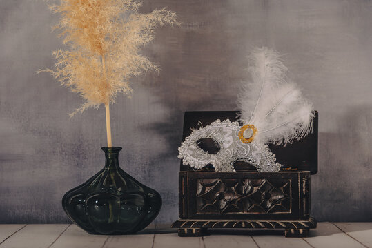 female carnival mask with glittering background whith shadows.