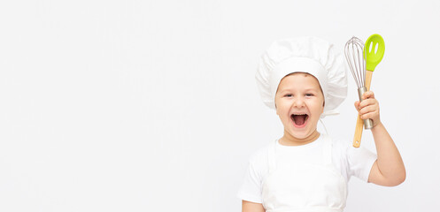 Smiling little cook with ladle and rolling pin, isolated on white