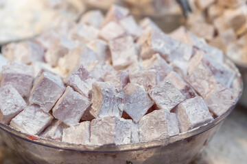Close up of Turkish delight sweet treat with powdered sugar at Mahane Yehuda Market in Jerusalem, Israel
