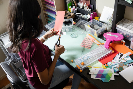 Woman doing craft project at desk