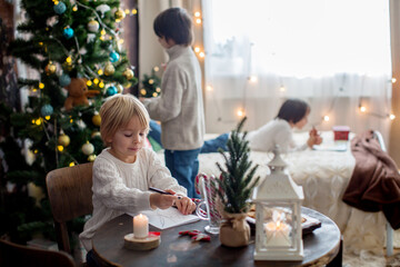 Happy family, enjoying christmas together in cozy home, decorated