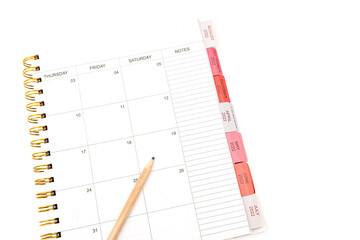 Spiral Notebook with wooden Pen on white background.