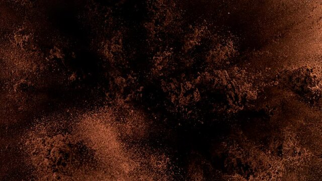 Super Slow Motion Shot of Ground Coffee Explosion on Black Background at 1000fps.