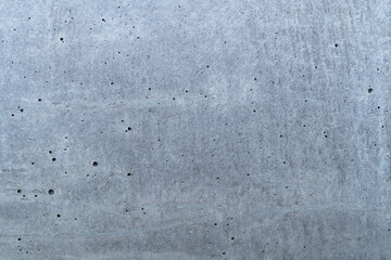 Concrete beton brut grunge wall or floor texture. Weathered cement with pores for modern interior design background wallpaper