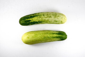 Two cucumbers isolated on white background. close up