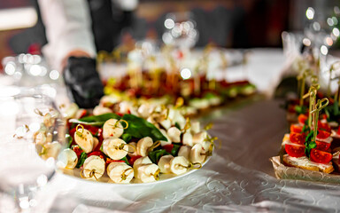 waiter holds tray with food. Restaurant service. buffet or catering.