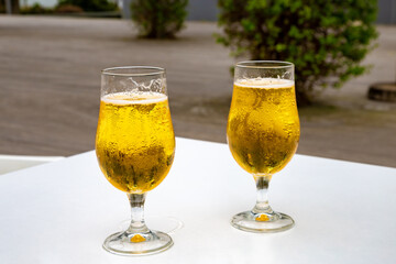 Two beer glasses on the table, Sete Cidades, São Miguel Island, Azores, Açores, Portugal, Europe.