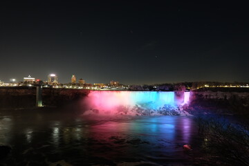 Fototapeta na wymiar American Falls, Bridal Veil Falls, Niagara Falls at night, with light pointing at it