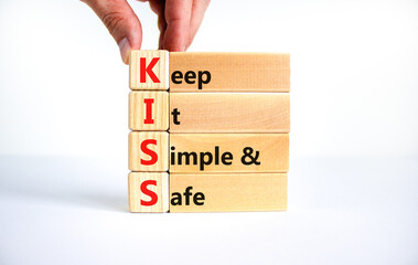 KISS keep it simple and safe symbol. Concept words KISS keep it simple and safe wooden blocks....