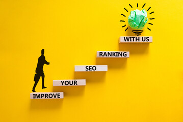Improve your SEO ranking with us symbol. Wooden blocks with words Improve your SEO ranking with us....