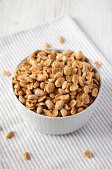 Roasted Salted Shelled Peanuts in a Gray Bowl, side view.