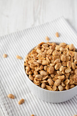 Roasted Salted Shelled Peanuts, side view. Copy space.