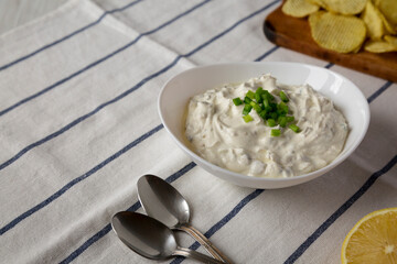 Homemade Clam Dip with Potato Chips, low angle view. Copy space.