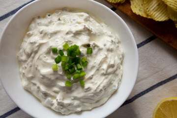 Homemade Clam Dip with Potato Chips, top view. Flat lay, overhead, from above.