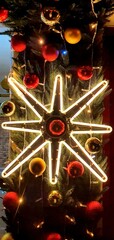 Glowing Christmas star for decoration. Christmas garland in the shape of a large star. New Year's decorations.