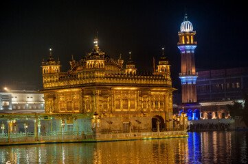 Naklejka na ściany i meble General view of the The Harmandir Sahib also Darbar Sahib, or Golden Temple pictured at night in Amritsar, Punjab, India