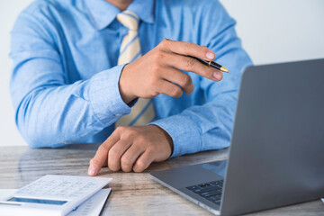 Financial businesswoman calculating corporate income tax data And analyzing charts of financial...