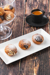 Bombolone or bomboloni is an Italian filled donut and snack food. German donuts - krapfen or berliner - filled with jam and chocolate