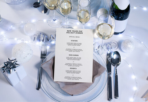 Cardboard Restaurant Menu on a Plate of Festive White Holiday Table