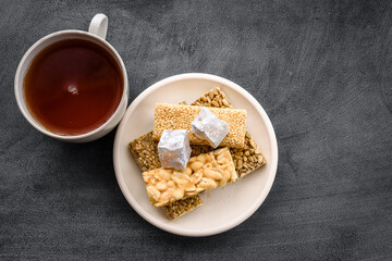 A cup of tea on a black background top view