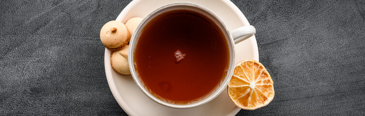A cup of tea on a black background top view