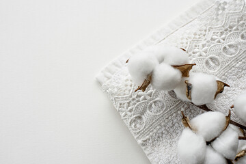 The stock banner is white with a cotton towel and a sprig of natural cotton. An ecological product.