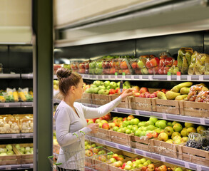 Woman buying fruits at the market