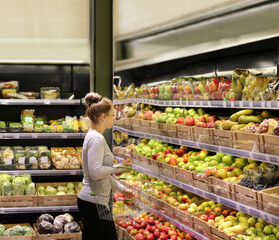 Woman buying fruits at the market