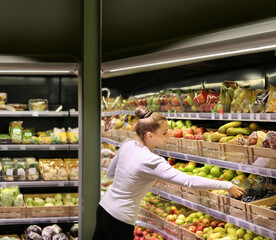 Woman buying fruits at the market