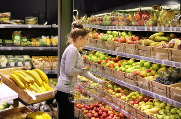Woman buying fruits at the market