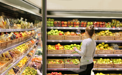 Woman buying fruits at the market
