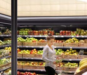 Woman buying fruits at the market