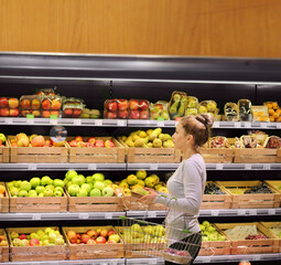 Woman buying fruits at the market
