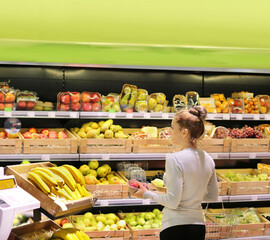 Woman buying fruits at the market