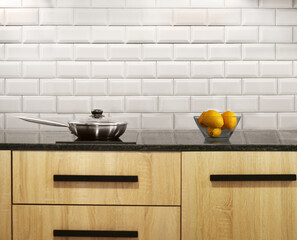 Steel pan and stewpan standing on kitchen stove