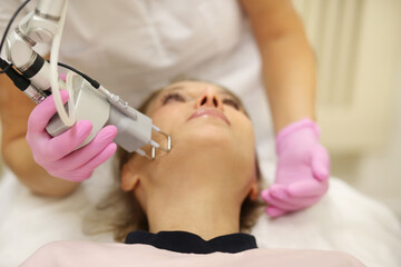 Obraz na płótnie Canvas Laser Treatment,Cosmetic Laser Dermatology ,dermatologist offices,laser technology