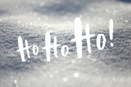 White Christmas background, glittering snowflakes, typography text "Ho ho ho!", handlettering.