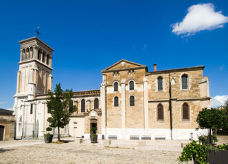 Saint-Apollinaire Cathedral in summer with blue sky in Valence, Drome, France - obrazy, fototapety, plakaty