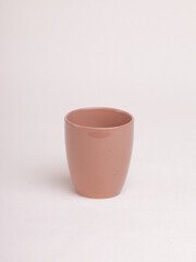 orange tea cup on a light background