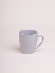 gray ceramic coffee mug on a light background