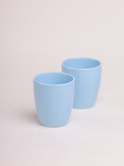 blue ceramic cup on a light background