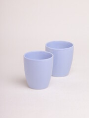 purple ceramic cup on a light background