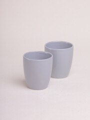 gray ceramic cup on a light background