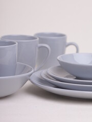 set of gray ceramic dishes on a light background