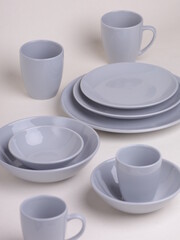set of gray ceramic dishes on a light background