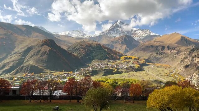 Mountain kazbek, Mkinvartsveri and town Stepantsminda, autumn colors of Georgia