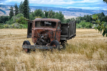 Abandoned truck in field
