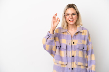 Young caucasian woman isolated on white background showing ok sign with fingers